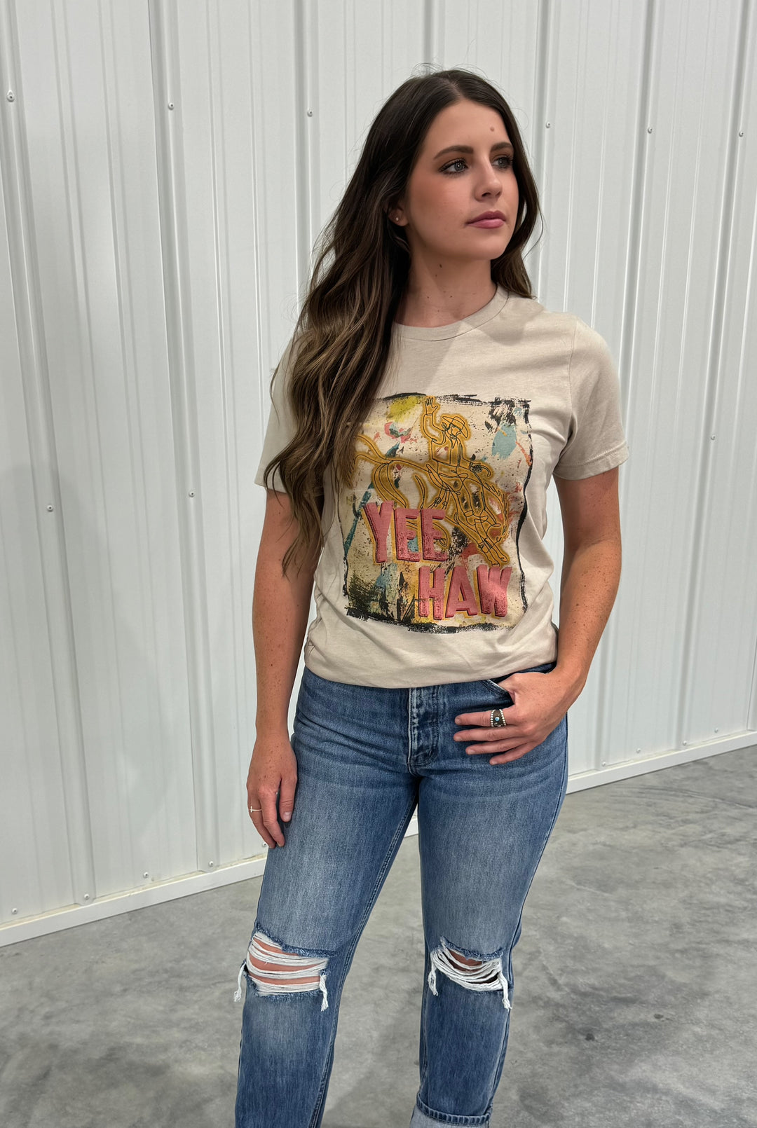 Show off your love for country style with the Belle Tan Splatter Cowboy Yeehaw Tee. This unisex tee features a trendy splatter design and is perfect for anyone looking to add a fun, laid-back vibe to their outfit. Available in a range of sizes from X-Small (0-2) to X-Large (12-14), this t-shirt offers a comfortable fit for all.