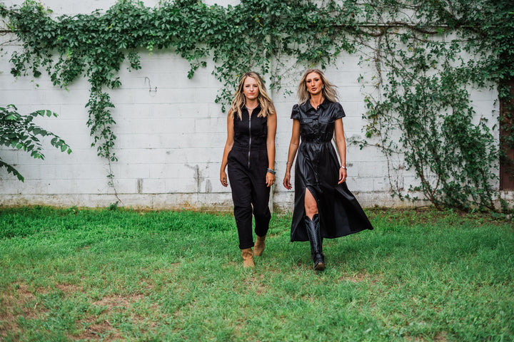 Step out in style with The Deadwood Dress in Black. This fashionable piece features short puff sleeves, a button-up front, and a collar neck, ensuring you look effortlessly chic. Made from 100% polyurethane with stylish side slits, it's available in small (2-4), medium (6-8), and large (8-10). Perfect for dressing up or down!