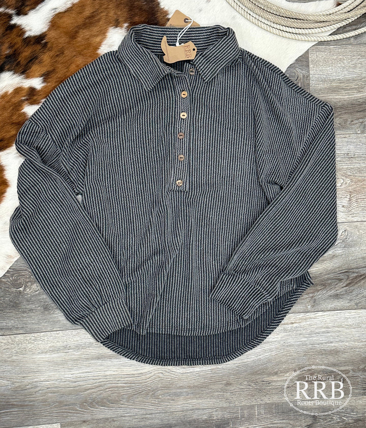 Trendy women’s charcoal pinstripe collared half button textured knit top with long sleeves, crafted from a blend of 72% polyester, 23% rayon, and 5% spandex. Available in Small (3-5), Medium (6-8), and Large (9-11). This stylish top pairs well with casual or dressy outfits, similar to offerings from top brands like Banana Republic and J.Crew.