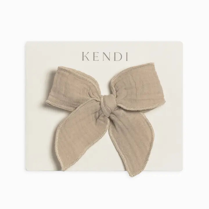 Clay muslin bow hair clip for toddlers and young girls crafted from soft lightweight fabric gentle on hair ideal for styling, everyday wear, or special occasions a practical and adorable hair accessory that makes a perfect gift for children and new moms.