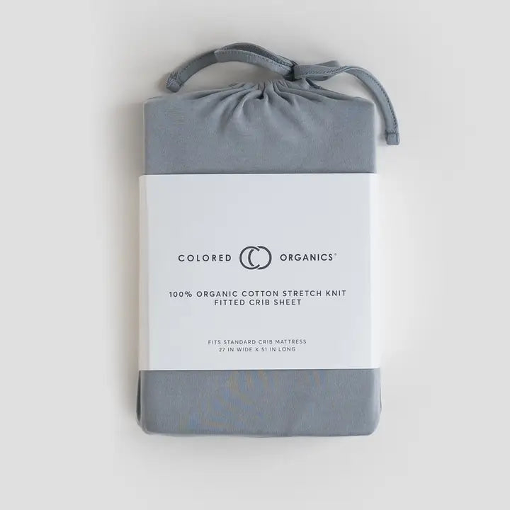 Fitted crib sheet in mist color made from soft breathable organic cotton gentle on newborn and infant skin perfect for cribs, bassinets, and toddler beds lightweight, durable, and easy to wash an essential baby bedding accessory and practical gift for new moms.