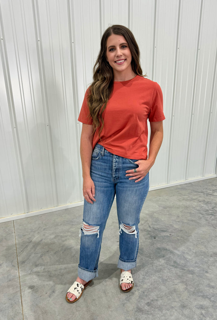 Stay chic and eco-conscious with The Ginger Spice Mom Basic Crop Top. This boxy tee design comes in a vibrant Ginger Spice color and is made from a blend of 95% organic cotton and 5% spandex. Runs a little small, so consider sizing up if you're in between sizes. Offered in sizes X-Small through X-Large.