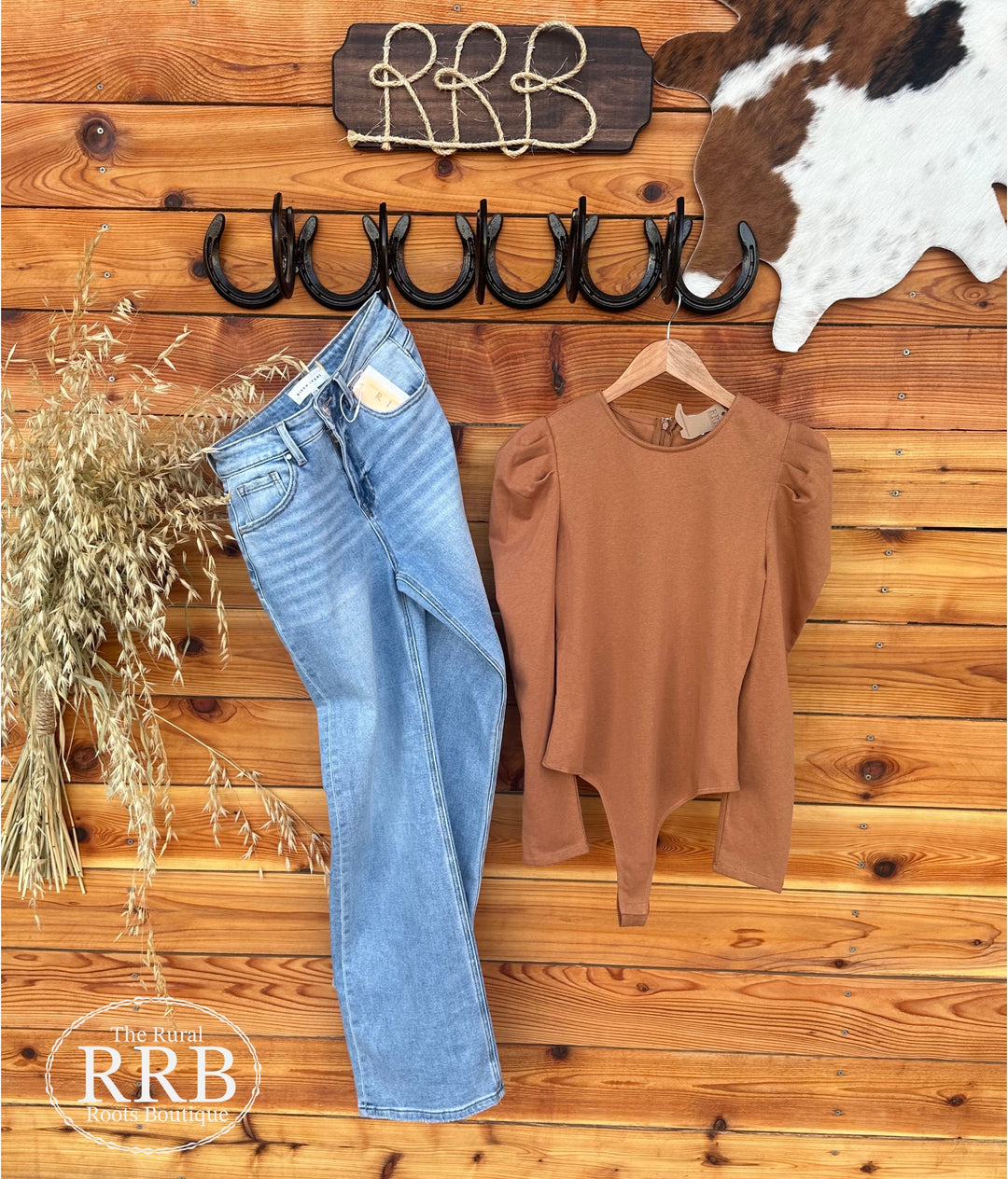 Discover sophistication with The Goldie Bodysuit in Camel. Designed with long puff sleeves and a practical back zipper, this bodysuit is made from 85% cotton and 15% polyester for a luxurious feel. It has little stretch, so we suggest sizing up if you're in between sizes. Available in Small, Medium, and Large.