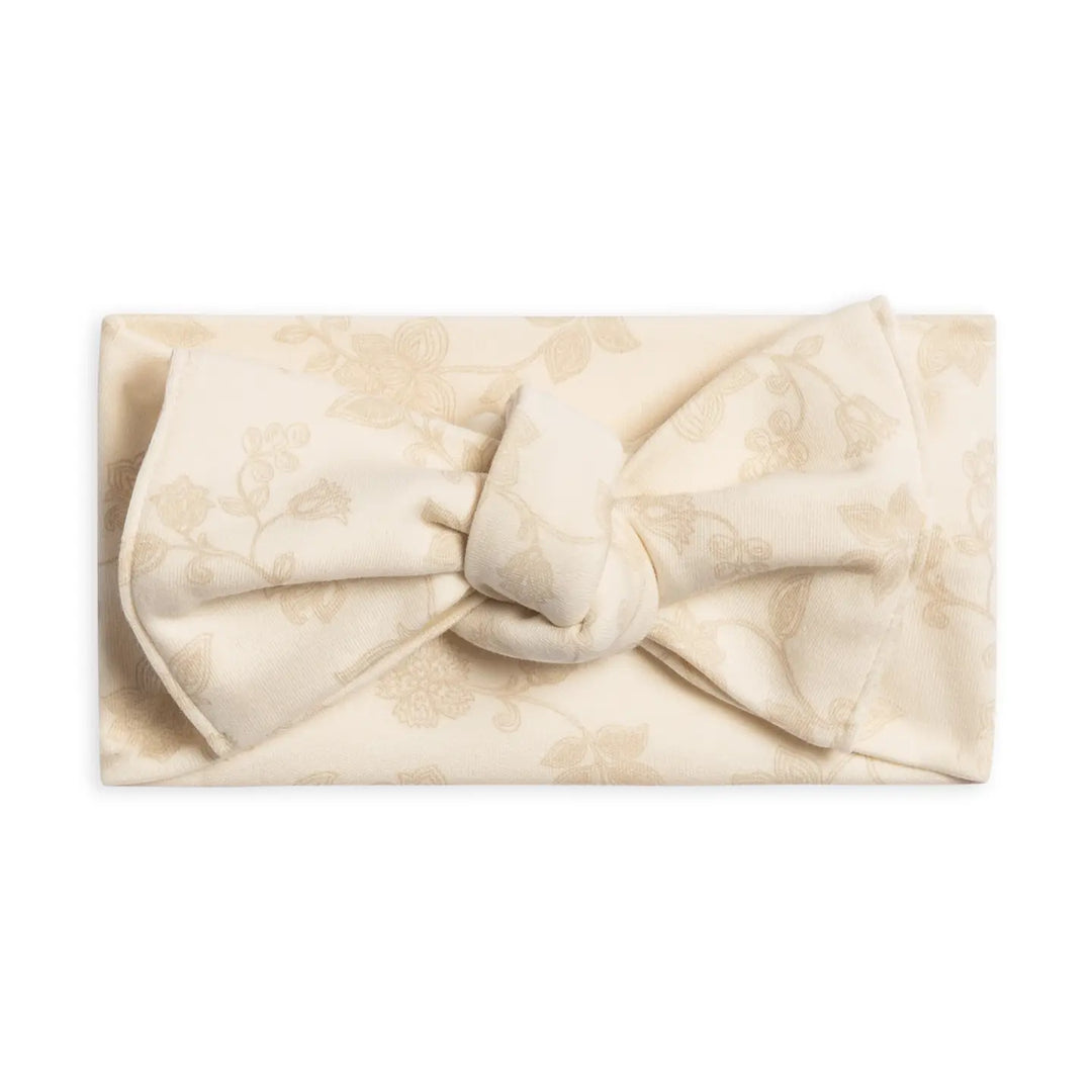 Hattie knot bow wrap baby headband in Aria floral print made from soft stretchy fabric gentle on newborn and infant skin perfect for everyday wear photo shoots and special occasions stylish and comfortable baby accessory for girls and a thoughtful gift for new moms.