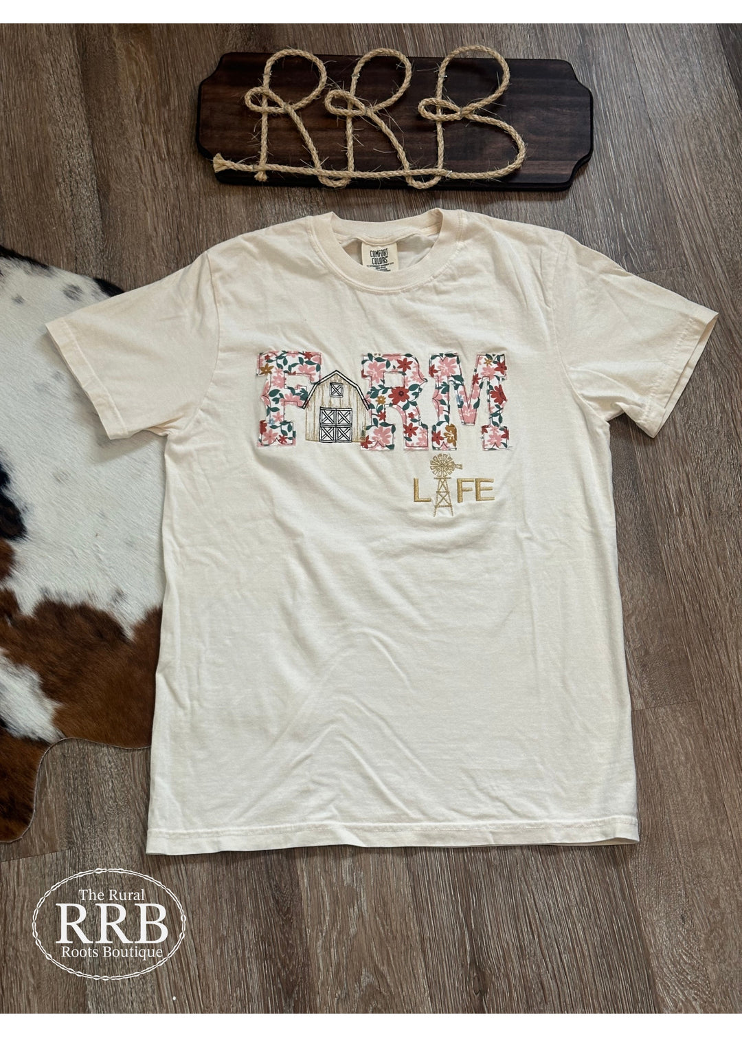 Experience comfort and style with The Farm Life Tee in ivory. This unisex t-shirt is made from a high-quality cotton blend and showcases beautiful hand embroidery, perfect for those who appreciate the farm lifestyle. Available in small, medium, and large sizes for the ideal fit.