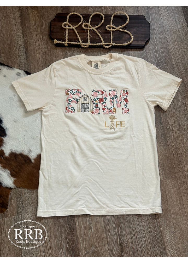 Experience comfort and style with The Farm Life Tee in ivory. This unisex t-shirt is made from a high-quality cotton blend and showcases beautiful hand embroidery, perfect for those who appreciate the farm lifestyle. Available in small, medium, and large sizes for the ideal fit.