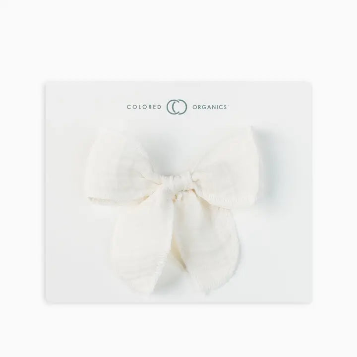 Ivory muslin bow hair clip for toddlers and young girls crafted from soft lightweight fabric gentle on hair ideal for styling, everyday wear, or special occasions a practical and adorable hair accessory that makes a perfect gift for children and new moms.