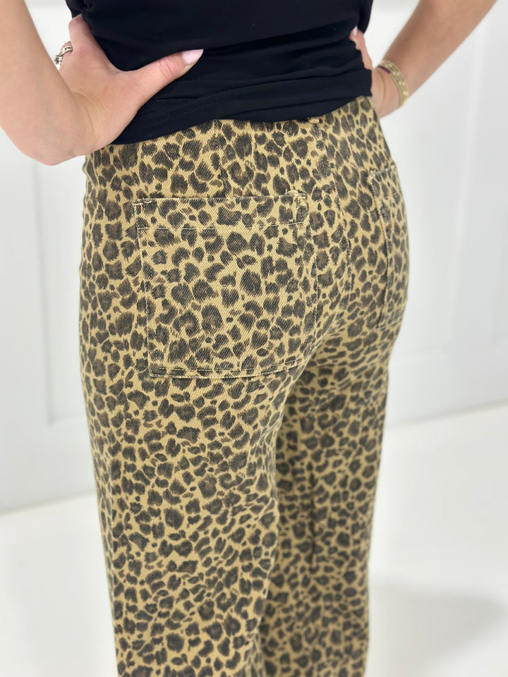 Bold and effortlessly cool, these leopard mid rise twill denim pants offer a relaxed wide leg fit with frayed hems for a touch of casual edge. Finished with a hidden button closure, they’re the perfect blend of wild style and everyday comfort.


