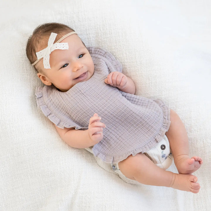 Lilla baby muslin ruffle bib made from soft organic cotton gentle on baby skin ideal for feeding, drooling, and teething easy to wash, breathable, and durable a practical and stylish baby essential for newborns and a thoughtful gift for new moms.
