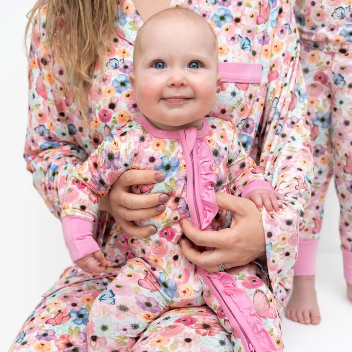 Lillians Garden bamboo baby footie in pink floral with convenient zip up design made from eco-friendly bamboo fabric gentle on newborn and infant skin perfect for sleeping, lounging, or everyday wear lightweight, breathable, and a cozy stylish baby essential for girls.