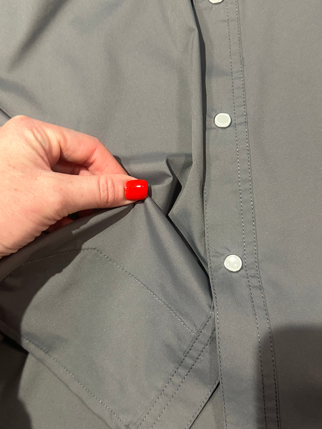 The Fischer (Grey) is the ultimate men’s lightweight shirt. Designed with breathable fabric and a classic pearl snap front, it offers 5 exterior pockets, a pen pocket, and an interior stitched lens cleaning cloth. Made with durable nylon and stretchy spandex, it’s perfect for outdoor adventures or everyday wear.