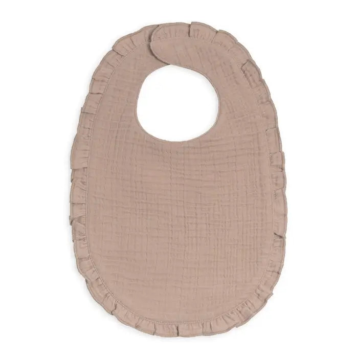 Organic baby muslin ruffle bib in beige made from 100 percent organic cotton fabric that is soft breathable and gentle on baby skin ideal for feeding drooling and teething this neutral beige baby bib makes the perfect baby shower gift for new moms and parents who want high quality eco friendly baby essentials designed for everyday use and easy washing this organic muslin baby bib adds style comfort and protection during feeding time while keeping babies clean and comfortable all day long