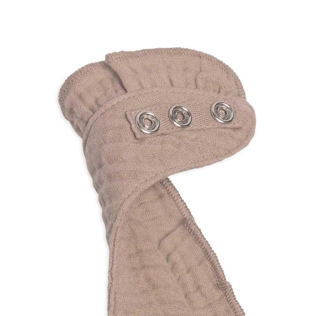 Organic cotton baby muslin ruffle bib in beige designed for eco conscious parents who want safe sustainable and natural baby products this neutral baby bib is made from lightweight breathable and absorbent muslin fabric perfect for keeping babies dry and clean during meals drooling and teething this beige ruffle bib pairs well with any baby outfit and makes a lovely addition to baby essentials collections or nursery gifts for new moms who love minimalist organic and practical baby accessories