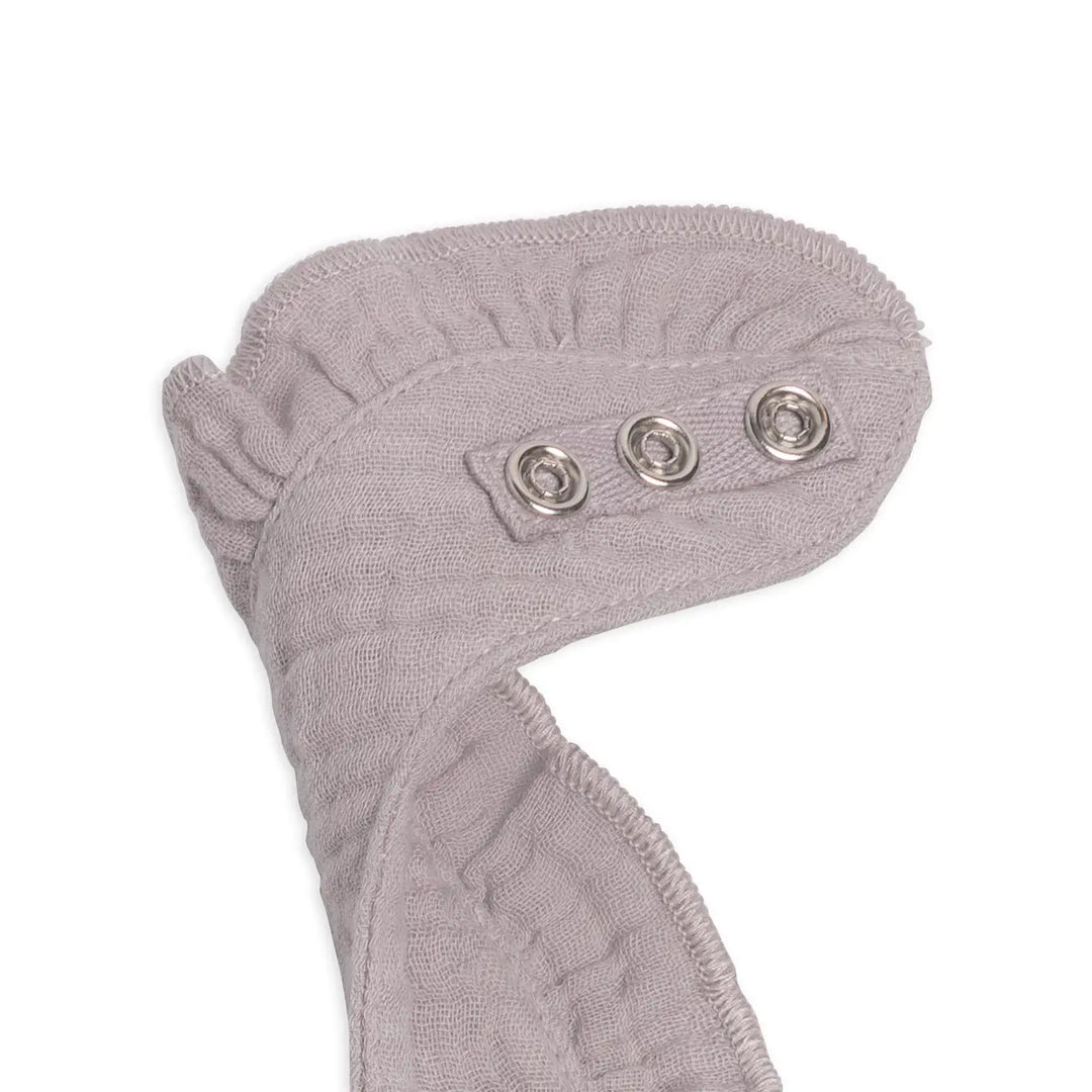 Organic muslin baby ruffle bib in lilla crafted from soft breathable cotton gentle on newborn and infant skin perfect for everyday feeding, drooling, or teething practical, durable, and stylish a baby accessory and thoughtful gift for new moms.