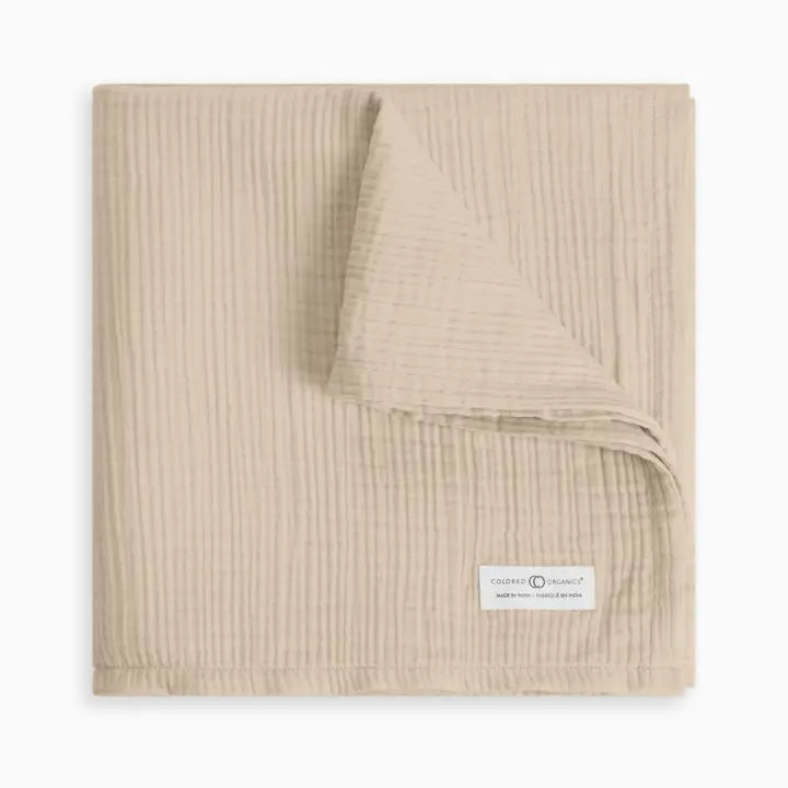 Organic muslin baby swaddle blanket in clay neutral color crafted from soft absorbent cotton gentle on newborn and infant skin ideal for swaddling cuddling or stroller use lightweight, breathable, and durable a must have practical and stylish baby essential for new moms.