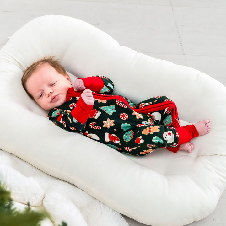 Scarlett bamboo baby footie in festive Christmas design made from eco-friendly breathable bamboo fabric gentle on newborn and infant skin perfect for sleep, play, or holiday gatherings lightweight, cozy, and a stylish essential baby sleeper for seasonal celebrations.