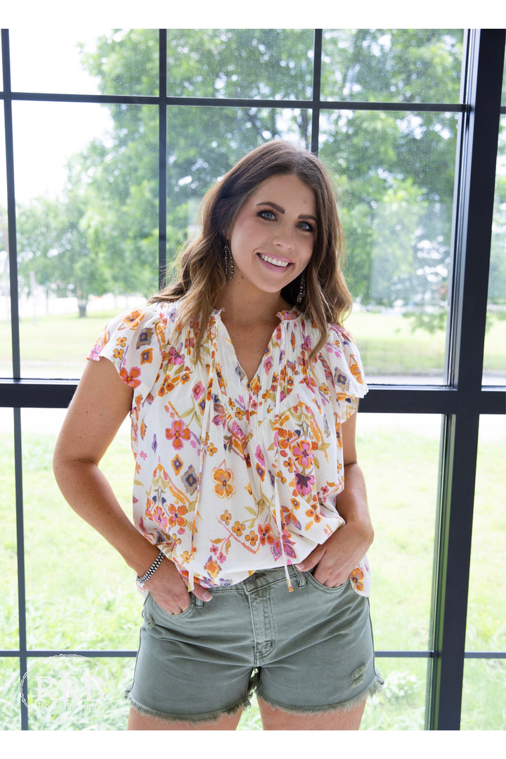 The Avery Shirt in cream multi features charming pintuck details and a relaxed fit for a stylish yet comfortable look. This women’s yoke tie neck top is made from 100% cotton, ensuring breathability and softness for all-day wear. Available in sizes small (3-5), medium (6-8), and large (9-11), it’s perfect for casual outings or dressing up. Comparable to tops from Free People and Anthropologie, The Avery effortlessly combines elegance with everyday style."
