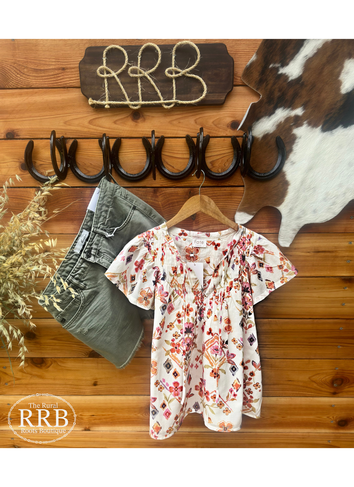 The Avery Shirt in cream multi features charming pintuck details and a relaxed fit for a stylish yet comfortable look. This women’s yoke tie neck top is made from 100% cotton, ensuring breathability and softness for all-day wear. Available in sizes small (3-5), medium (6-8), and large (9-11), it’s perfect for casual outings or dressing up. Comparable to tops from Free People and Anthropologie, The Avery effortlessly combines elegance with everyday style.