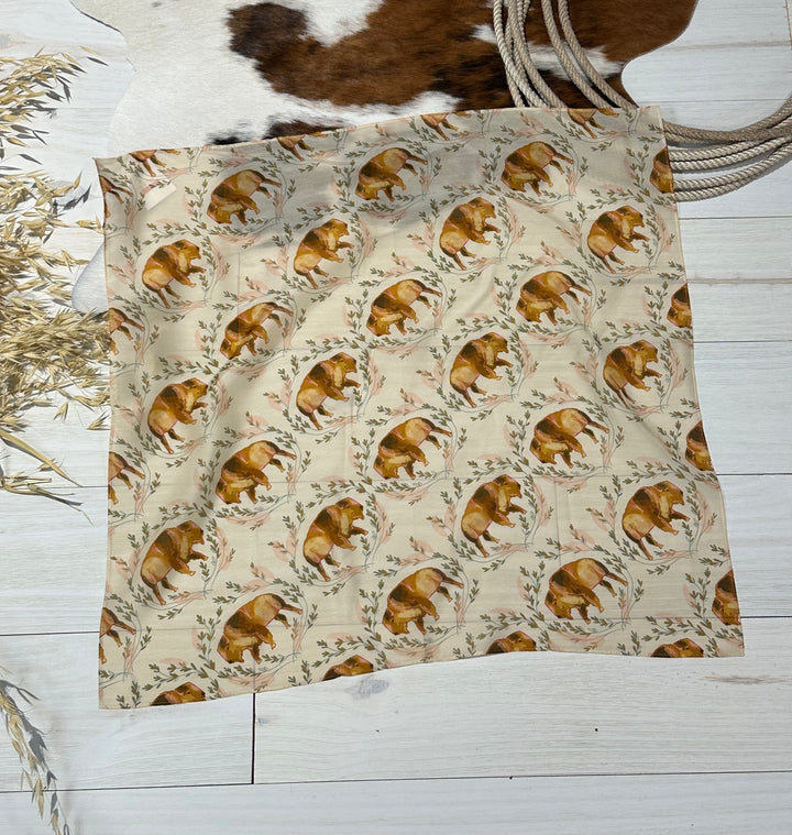 The Buffalo Wildrag, a premium western wild rag made of 100% Mulberry silk, hand-drawn and designed. Multi-use accessory for bandanas, headbands, ponytails, and neck scarves.