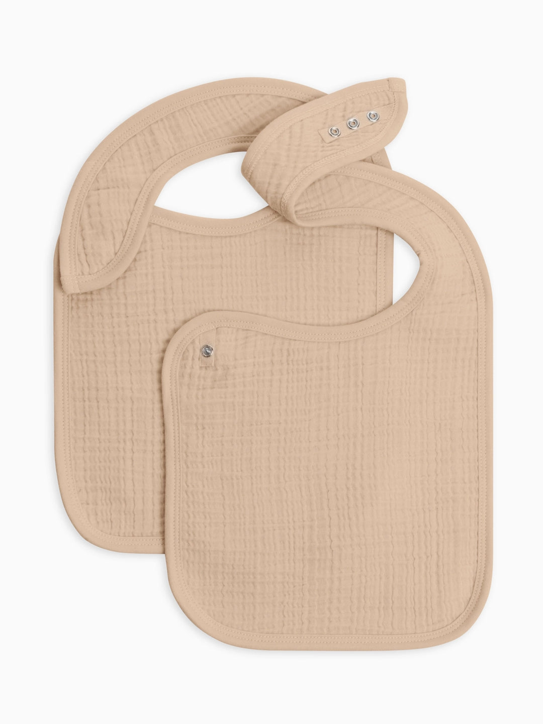 Two pack muslin baby bib set in clay color crafted from premium organic cotton muslin soft lightweight and durable ideal for everyday feeding and drooling a must have for parents seeking stylish practical and eco friendly baby essentials.