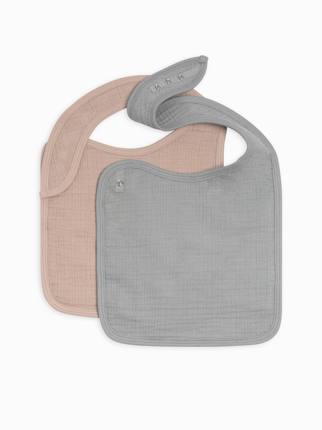 Two pack muslin baby bib set in mist and clay colors crafted from premium organic cotton muslin soft lightweight and absorbent perfect for feeding time drooling and teething practical and stylish baby accessory for everyday use.