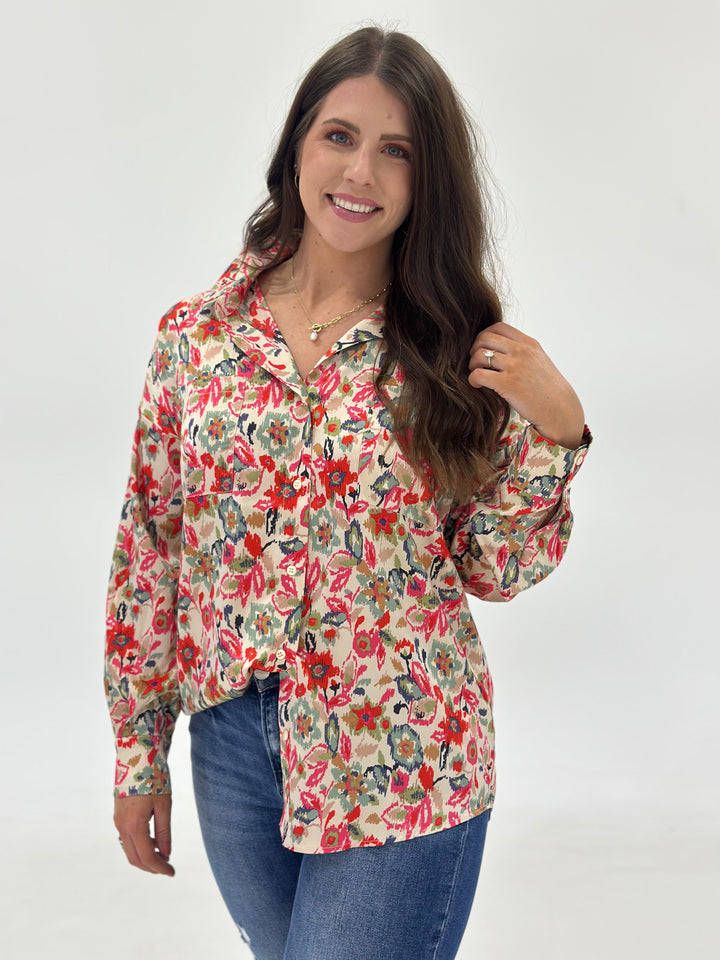 The Cora Abstract Print Button Down Shirt features a bold, modern print, long sleeves, and a contemporary fit, crafted from 100% polyester for comfort and durability. Available in Small (3-5), Medium (6-8), and Large (9-11).
