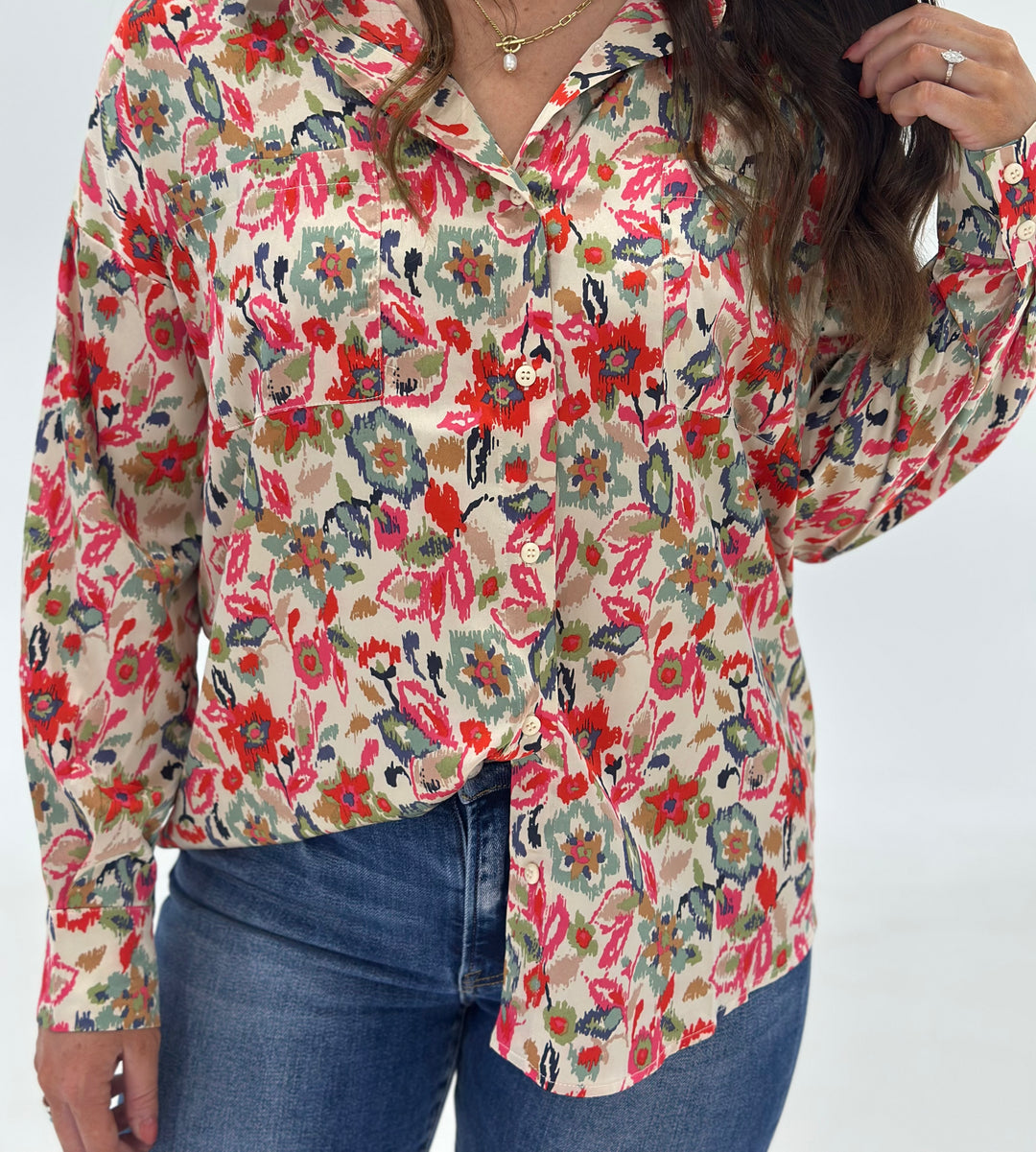 The Cora Button Down Shirt in abstract print offers long sleeves and a contemporary fit, made with 100% polyester for a sleek, easy-care style. Available in Small (3-5), Medium (6-8), and Large (9-11).