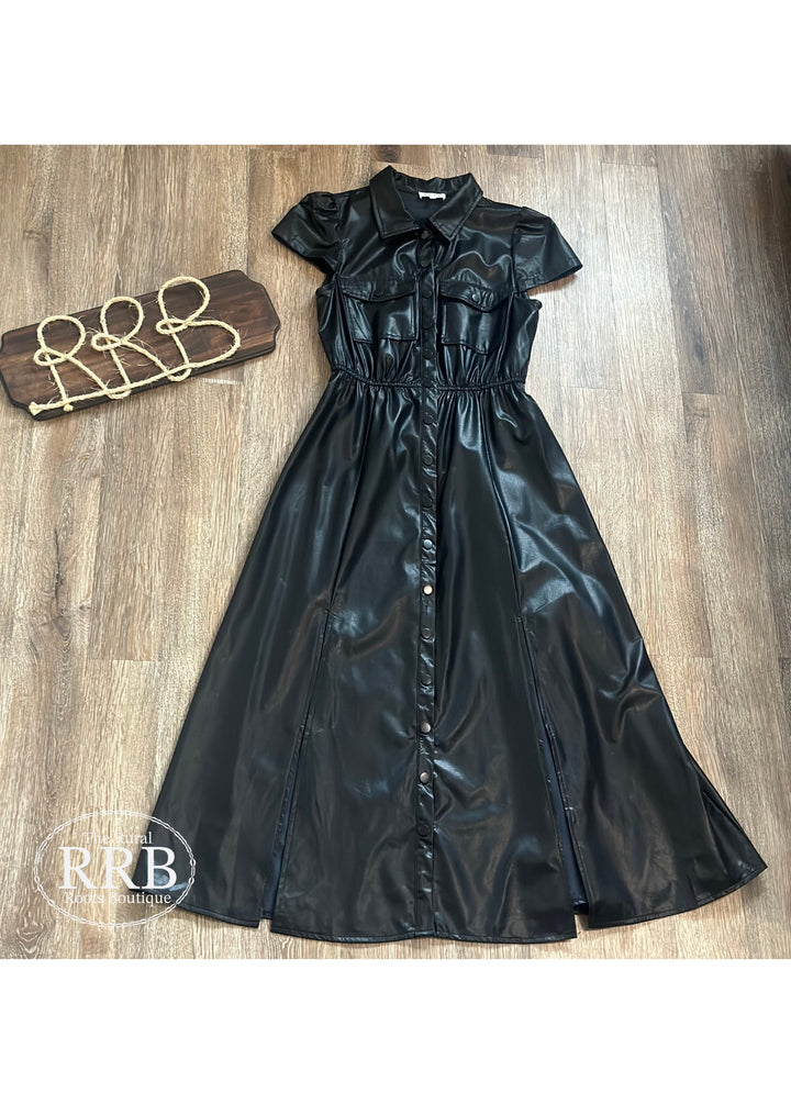 Elevate your wardrobe with The Deadwood Dress in Black. Featuring short puff sleeves, a chic button-up design, and a classic collar neck, this dress is both fashionable and versatile. Made from 100% polyurethane, it offers a sleek look with side slits for added flair. Available in small (2-4), medium (6-8), and large (8-10). Perfect for any occasion!