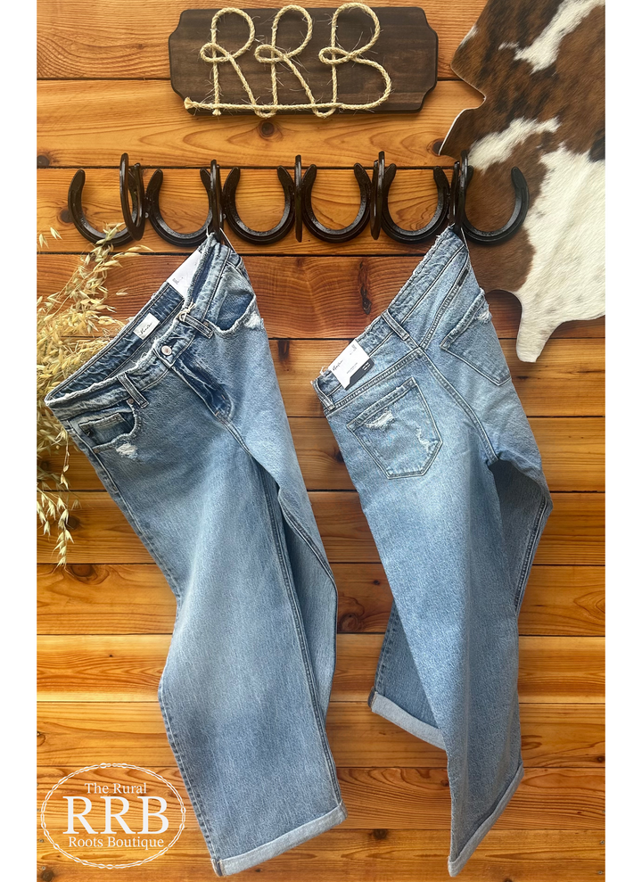 Discover The Decatur High Rise Wide Leg Jeans, designed for both style and comfort. Featuring a medium stone wash, these jeans offer a flattering high rise and wide leg fit. Crafted from a soft blend of 99% cotton and 1% spandex, they include a zipper fly, regular hem, and a unique double flow hem for added flair. Rise: 10”, Inseam: 27” (after 1½” double fold). Perfect for casual outings or dressing up!