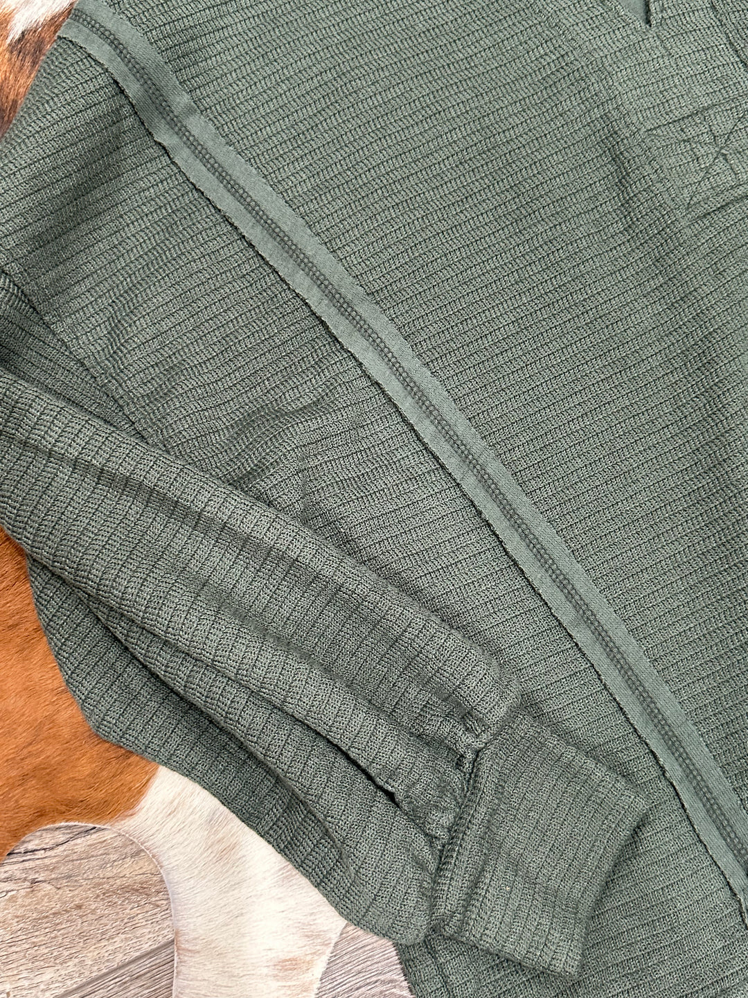 Add a touch of unique style to your wardrobe with The Destin Sweater Knit Top in hunter green. With a relaxed fit, split neck, and long sleeves, this top features eye-catching patchwork and raw edge details. Crafted from a comfortable blend of 55% polyester, 42% rayon, and 3% spandex, it’s a versatile piece for any occasion.