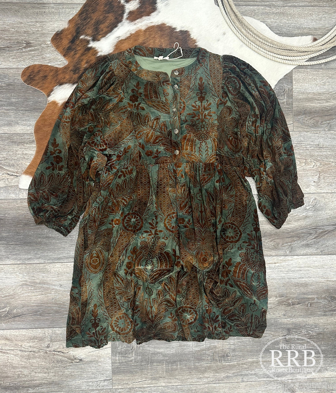 Elevate your wardrobe with The Dusty Velvet Dress in dusty green. Featuring a round neckline, button placket, and three-quarter puff sleeves, this lightweight dress is perfect for any occasion. With side pockets and a non-sheer design, it’s crafted from a comfortable blend of 95% polyester and 5% spandex, making it an ideal choice for effortless elegance.