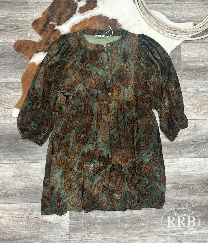 Elevate your wardrobe with The Dusty Velvet Dress in dusty green. Featuring a round neckline, button placket, and three-quarter puff sleeves, this lightweight dress is perfect for any occasion. With side pockets and a non-sheer design, it’s crafted from a comfortable blend of 95% polyester and 5% spandex, making it an ideal choice for effortless elegance.