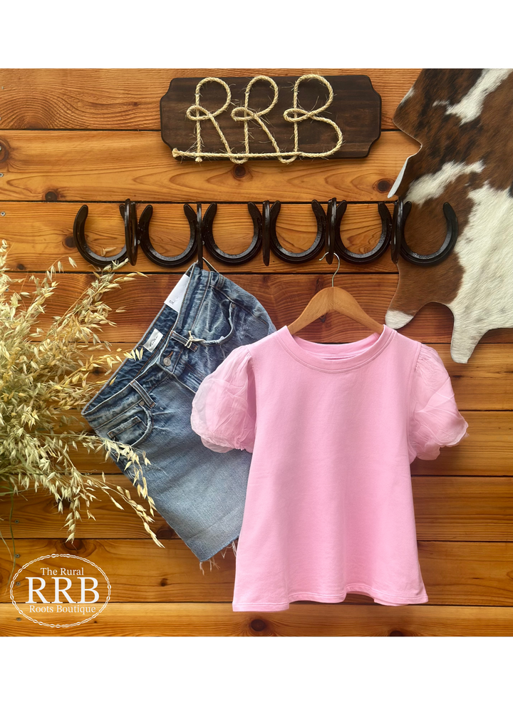 Elevate your wardrobe with The French Terry Pink puff sleeve top, featuring a comfortable body length of 46 inches and a bust width of 38¼ inches. Made from a soft blend of 95% cotton and 5% viscose, this top is available in sizes X-Small to Large, perfect for a stylish yet relaxed look.