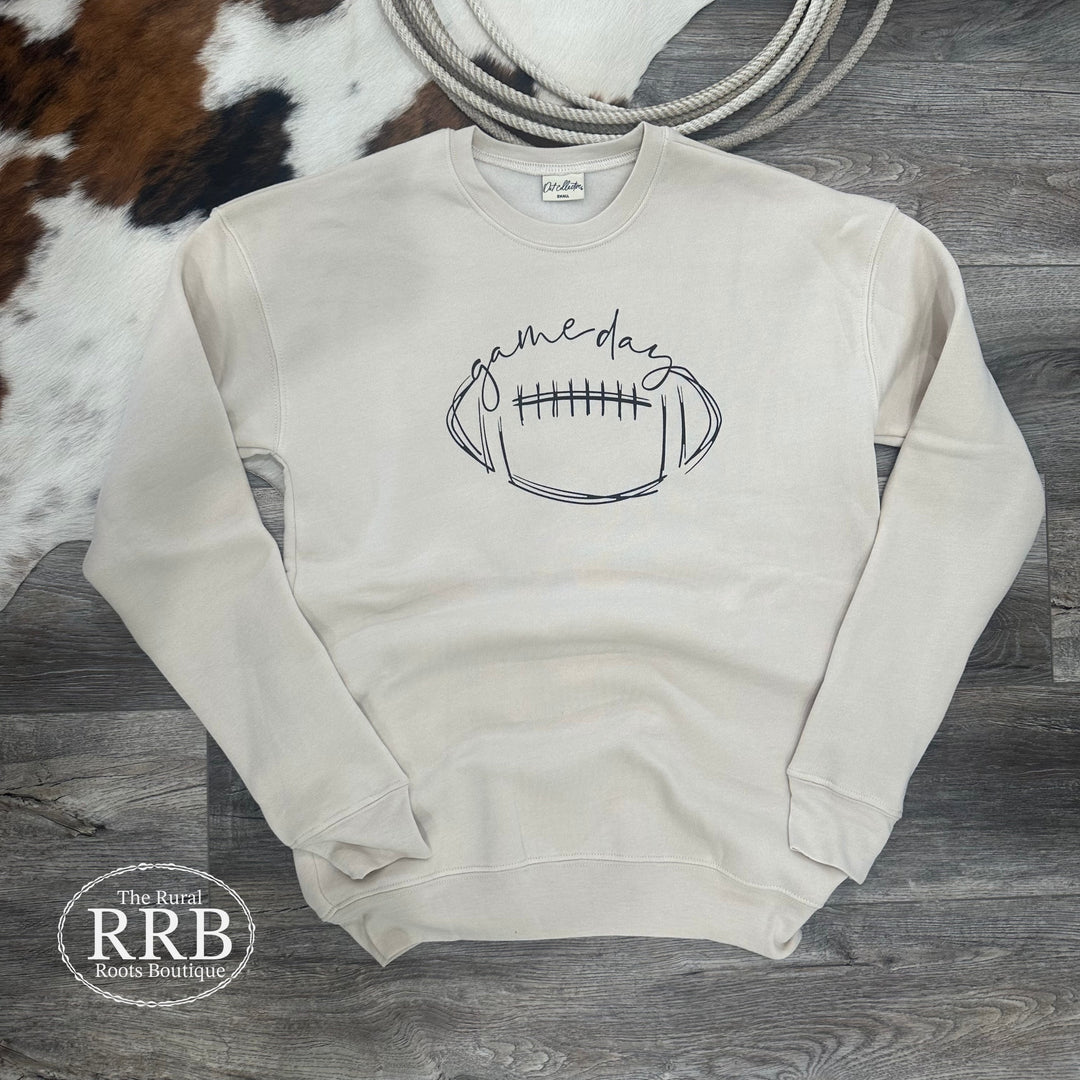 Get game-ready with The Gameday graphic sweatshirt in Heather Dust. Made from a remarkably soft blend of 52% cotton and 48% polyester, this sweatshirt offers a fitted design in the arms. Available in sizes Small to X-Large, we recommend sizing up if you're in between sizes for the perfect fit.