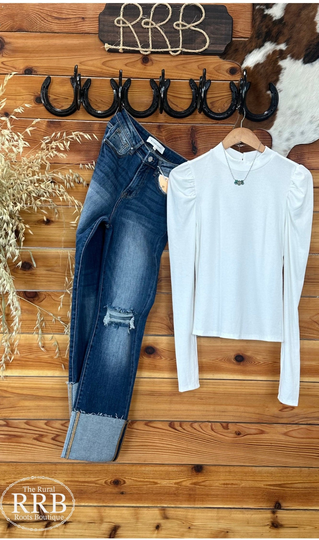 Elevate your wardrobe with The Hico Ripped Puff Sleeve Shirt in white. Crafted from a comfortable blend of 60% polyester, 35% rayon, and 5% spandex, this shirt features trendy puff sleeves and a stylish ripped design. Available in sizes Small (2-4), Medium (6-8), and Large (8-10), it offers a flattering fit that's perfect for any casual occasion.