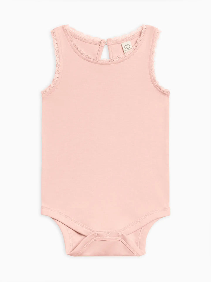 The Luna Bodysuit is a wardrobe essential designed with your baby’s comfort and safety in mind. Crafted from 100% organic cotton, it is naturally hypoallergenic, soft, and gentle on delicate skin. Durable water-based dyes ensure vibrant, long-lasting color, while nickel-free snaps make dressing and diaper changes easy and safe. Thoughtfully and ethically produced with sustainably sourced materials, this bodysuit aligns comfort, practicality, and eco-conscious values. Machine washable and tumble dry-friendly