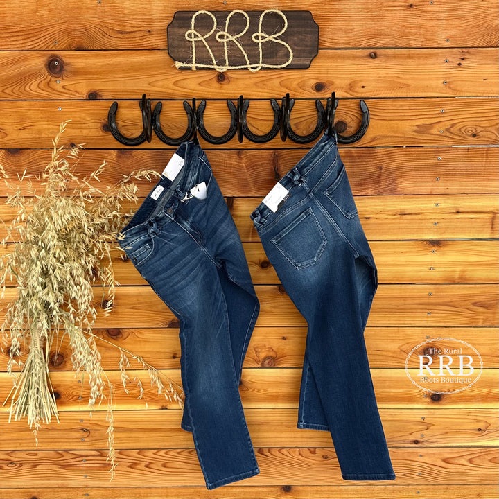 Stylish The Mabel mid rise slim straight jeans featuring a dark wash and a slim straight fit. These jeans have a rise of 9.25 inches and an inseam of 27 inches in size 26, along with a regular hem, basic five-pocket design, zipper fly, and belt loops for added functionality. Made from a comfortable blend of 93% cotton, 5% polyester, and 2% spandex, these jeans are perfect for everyday wear, comparable to popular styles from Madewell and Everlane