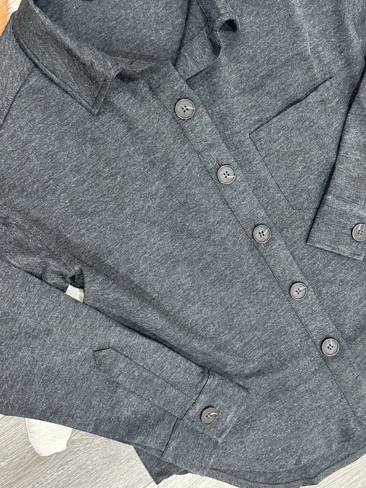 Effortless style with The Macon charcoal shacket, offering a relaxed fit and button-down closure. Designed with a collared neck, single chest pocket, and U hem, this unlined shacket is lightweight and comfortable. Made from 87% polyester, 9% rayon, and 4% spandex, it’s ideal for layering. Sizes include Small (3-5), Medium (6-8), and Large (9-11), recommended to size down if in-between. Comparable to options from Nordstrom and Abercrombie & Fitch.