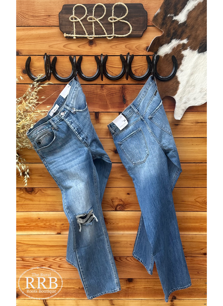 Vintage-inspired Monica ultra high-rise boyfriend jeans with a medium dark stone wash, knee distress, and a hidden button fly. Crafted from 100% cotton, these jeans feature a regular hem with a 12” rise and 31” inseam (based on size 5/26). Perfect for a relaxed, laid-back 90's look, similar to styles from Levi’s and AGOLDE.