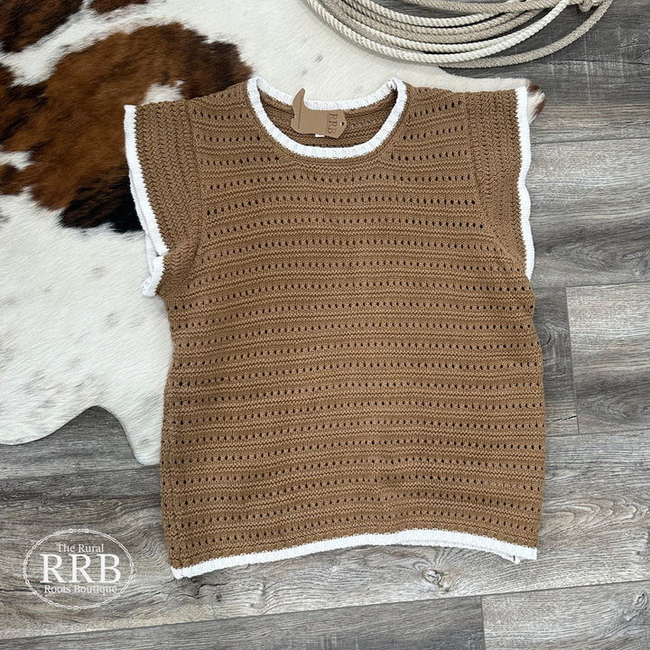 Elevate your wardrobe with The Rory open knit sweater top in a lovely mocha and cream color combination. This relaxed-fit design features a round neck and stylish contrast detail, made from a soft blend of 60% cotton and 40% acrylic. Available in Small (2-4), Medium (6-8), and Large (8-10) for effortless layering.