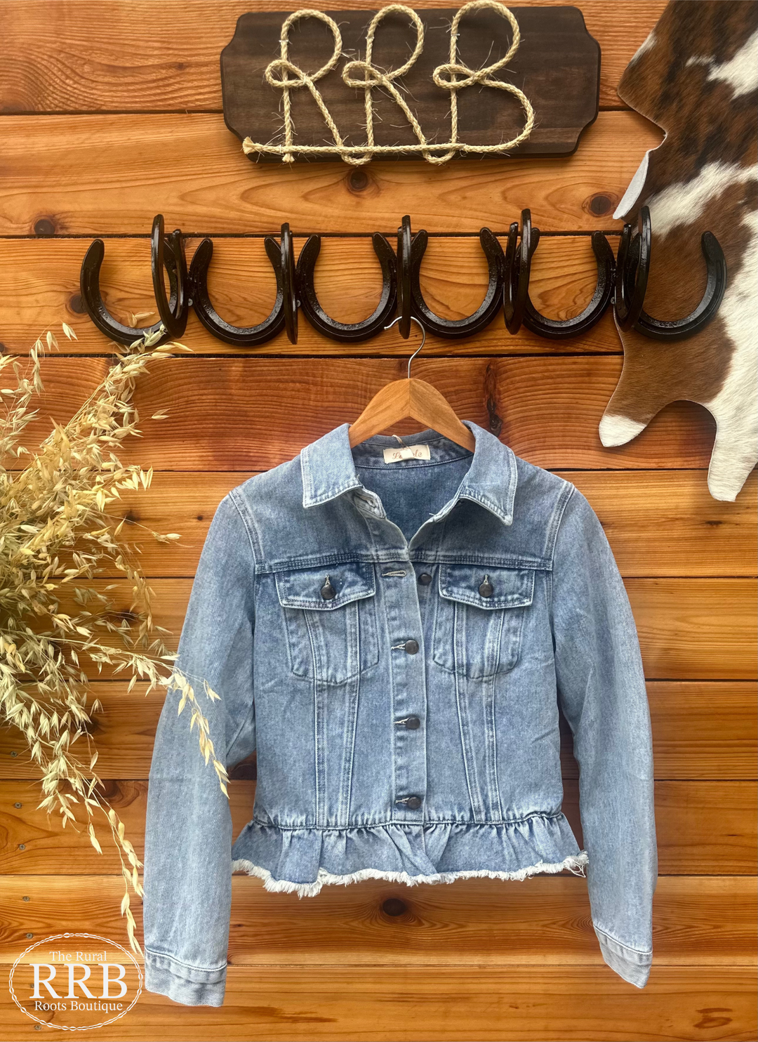 Elevate your wardrobe with The Sandhills Jacket, featuring a trendy ruffle hem and light distressing for a chic, laid-back look. This stylish jacket includes long sleeves with button cuffs, a classic collar neckline, and flap pockets on the front chest. Available in Small (3-5), Medium (6-8), and Large (9-11), it's perfect for layering over your favorite outfits.