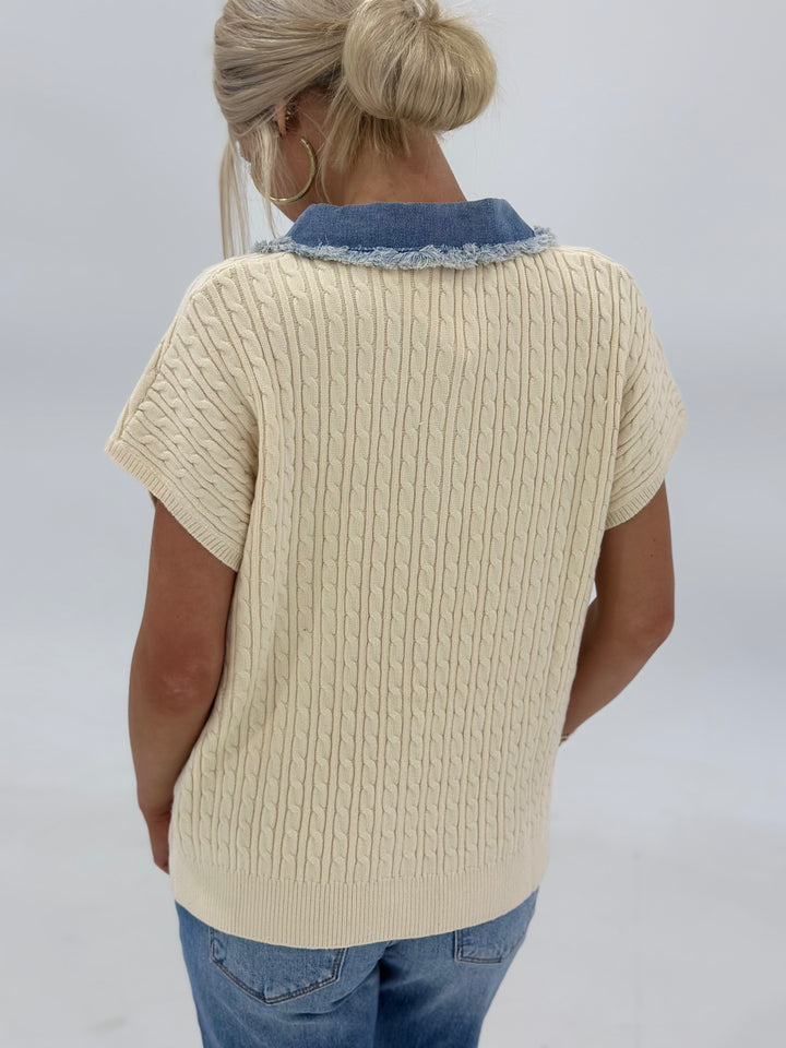 The Sawyer Jacket merges cozy cable sweater texture with distressed denim contrast, a patch pocket, and short dolman sleeves for a stylish yet laid-back look. Available in Small (3-5), Medium (6-8), Large (9-11), and X-Large (12-15).