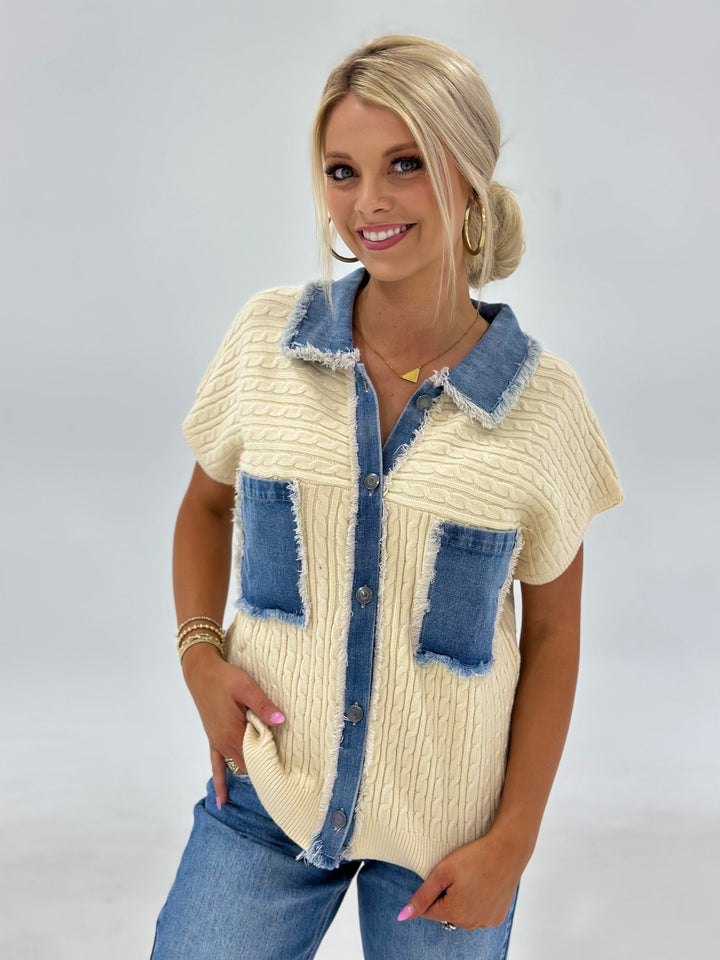  The Sawyer Cable Sweater Jacket blends cozy texture with edgy style, featuring a distressed denim contrast, patch pocket, and short dolman sleeves for a relaxed fit. Available in Small (3-5), Medium (6-8), Large (9-11), and X-Large (12-15).