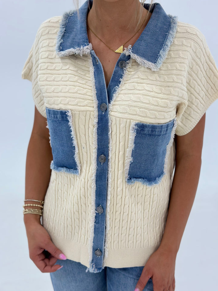 The Sawyer Cable Sweater Jacket combines a soft knit with a distressed denim contrast, a button-down front, patch pocket, and short dolman sleeves for an effortlessly cool, relaxed fit. Available in Small (3-5), Medium (6-8), Large (9-11), and X-Large (12-15).