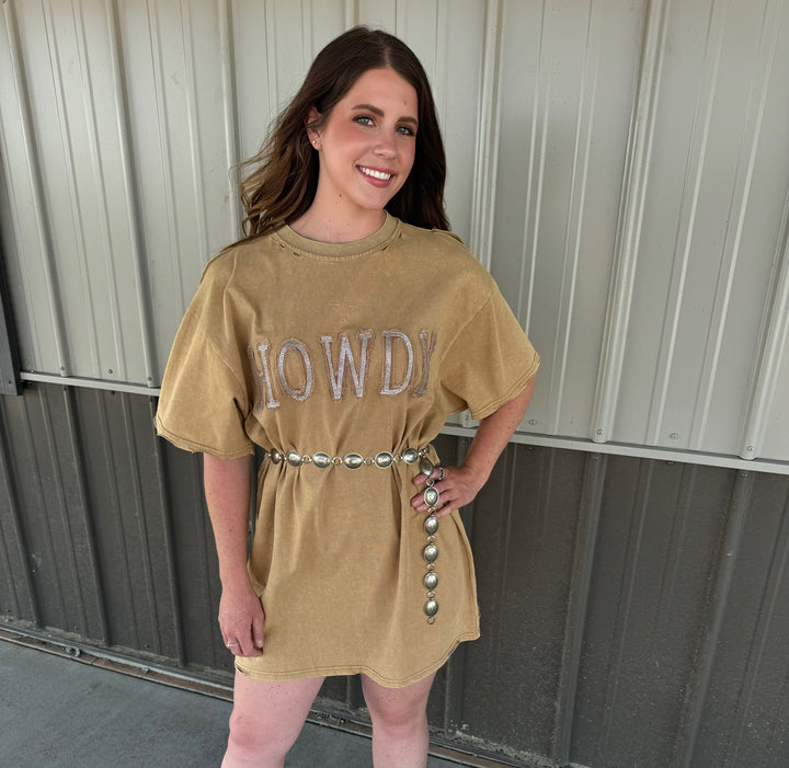 Elevate your casual wardrobe with The ShineDown tan t-shirt dress, featuring an embellished stone graphic and fashionable star stitching. The relaxed fit, coupled with distressed shoulder edge details, creates a trendy silhouette. Crafted from 100% cotton, this dress is both stylish and comfortable for everyday wear.