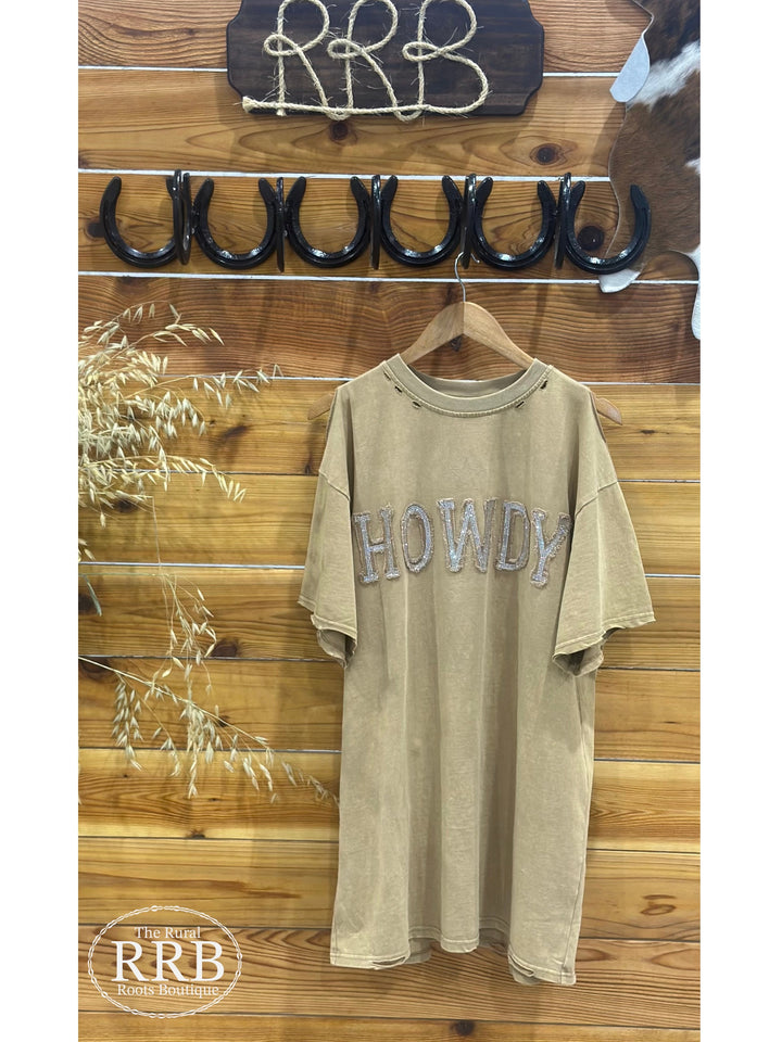 Step out in style with The ShineDown, a trendy tan t-shirt dress featuring an embellished stone graphic and unique star stitching. Designed with distressed shoulder edge details for a relaxed, laid-back look, this dress is crafted from 100% cotton for all-day comfort. Perfect for casual outings or layered for added flair.