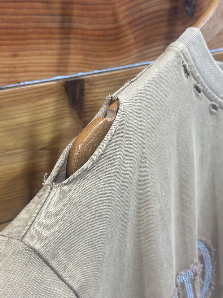 Discover comfort and style with The ShineDown tan t-shirt dress, featuring an eye-catching embellished stone graphic and star stitching. The distressed shoulder edge detail enhances the relaxed fit, making it perfect for any casual occasion. Crafted from 100% cotton, this dress combines quality with a trendy design.