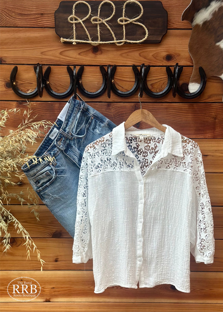 Elevate your wardrobe with The Star Lace Button Down in an elegant off-white hue. This stylish button-up shirt features intricate star lace detailing, perfect for adding a touch of sophistication to any outfit. Available in sizes Small (3-5), Medium (6-8), and Large (9-11), it's ideal for both casual and dressy occasions.