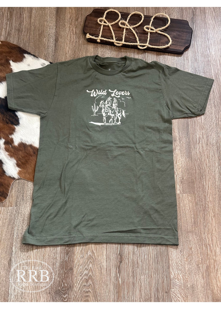 Show your wild side with The Wild Lovers Tee in olive green, featuring cream thread hand embroidery. This unisex-fitting shirt is made from a premium cotton blend for comfort and durability. Available in sizes Small (3-5), Medium (6-8), Large (9-11), and X-Large (12-14), it’s perfect for any outdoor adventure.