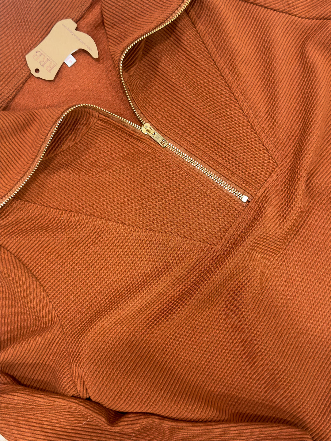 Stay stylish and cozy in The Winona camel pullover. This relaxed-fit top features a collared design, front zipper, and long sleeves, crafted from a comfortable blend of 95% polyester and 5% spandex. Available in sizes Small to Large, it’s perfect for layering or wearing on its own.